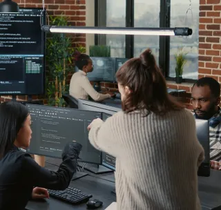 Developers reviewing code during a sprint