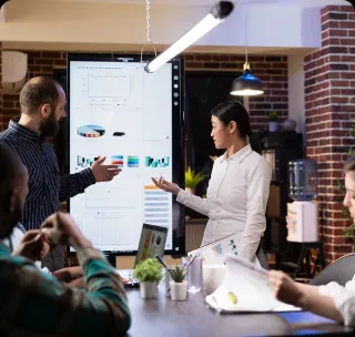 Solution architect mapping a client workflow on a whiteboard